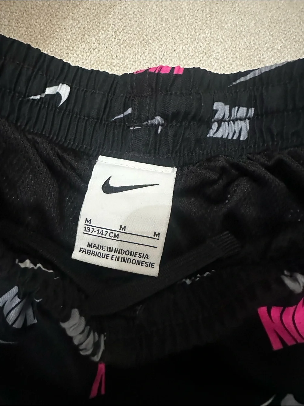 Nike boys swimsuit black and pink